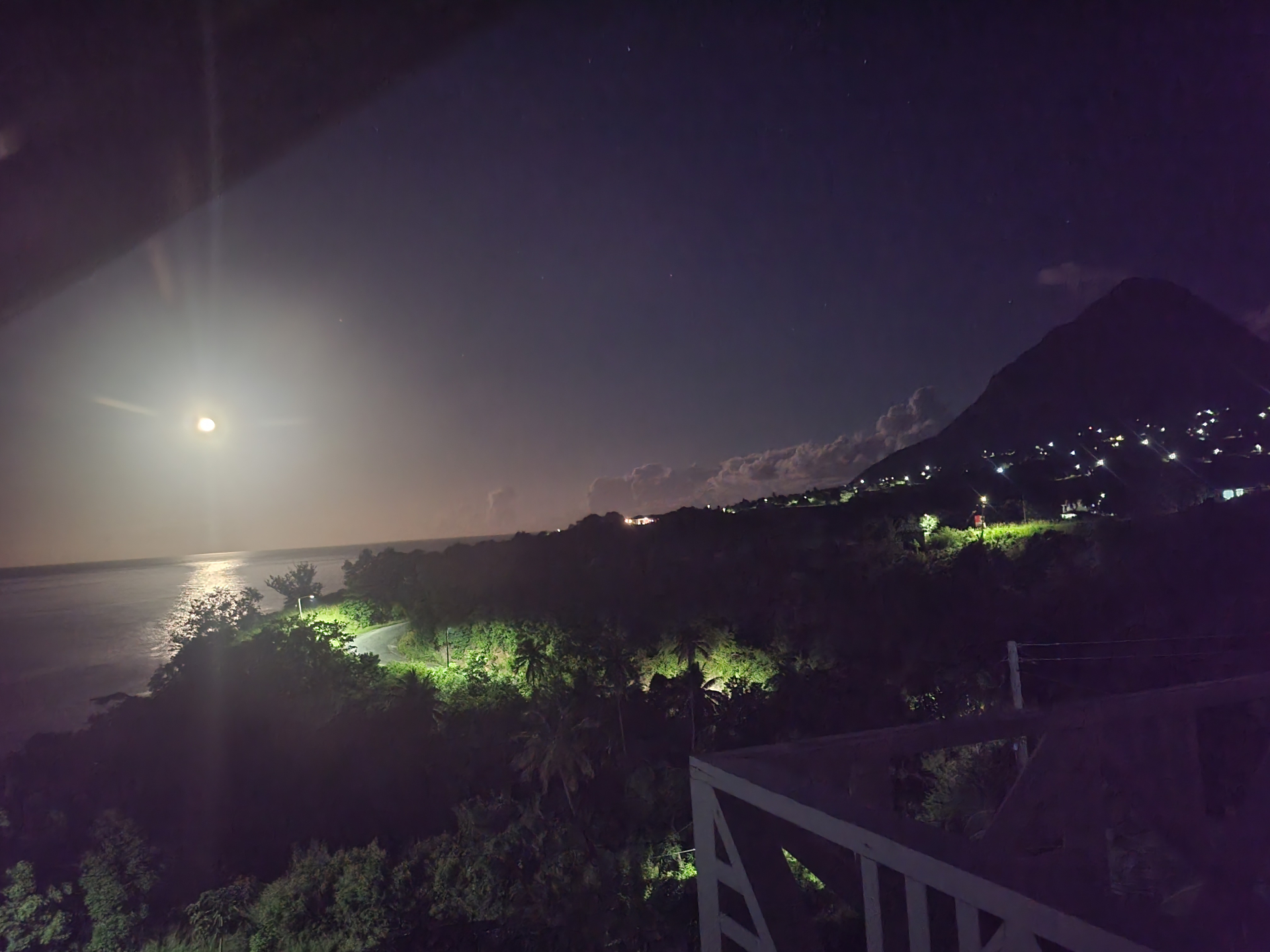 Night view from the villa with moonlight over the sea and mountain silhouette