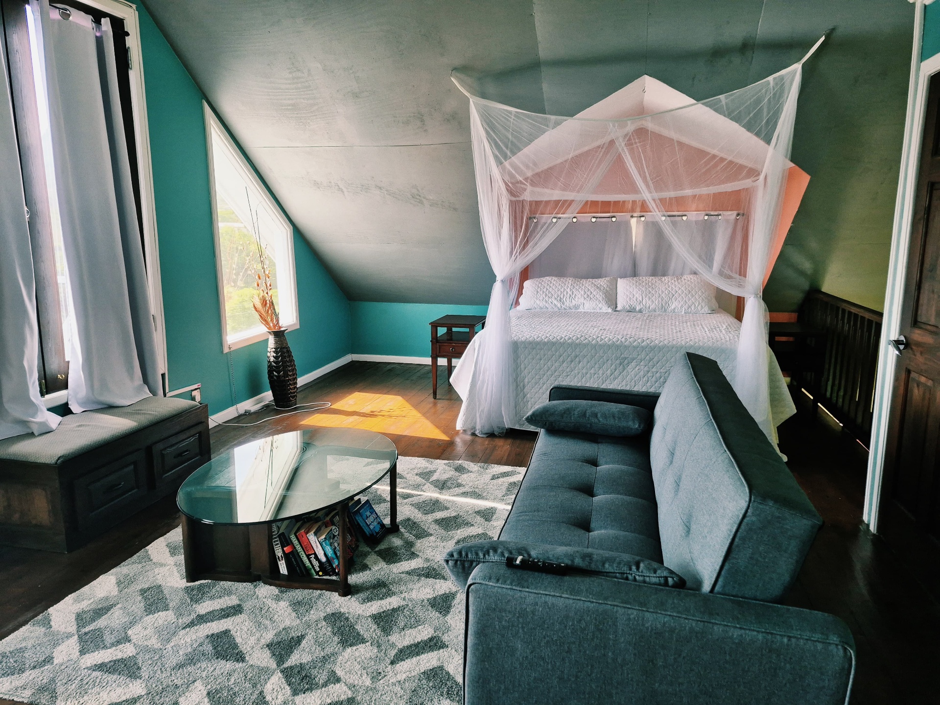Loft suite with canopy bed and lounge seating