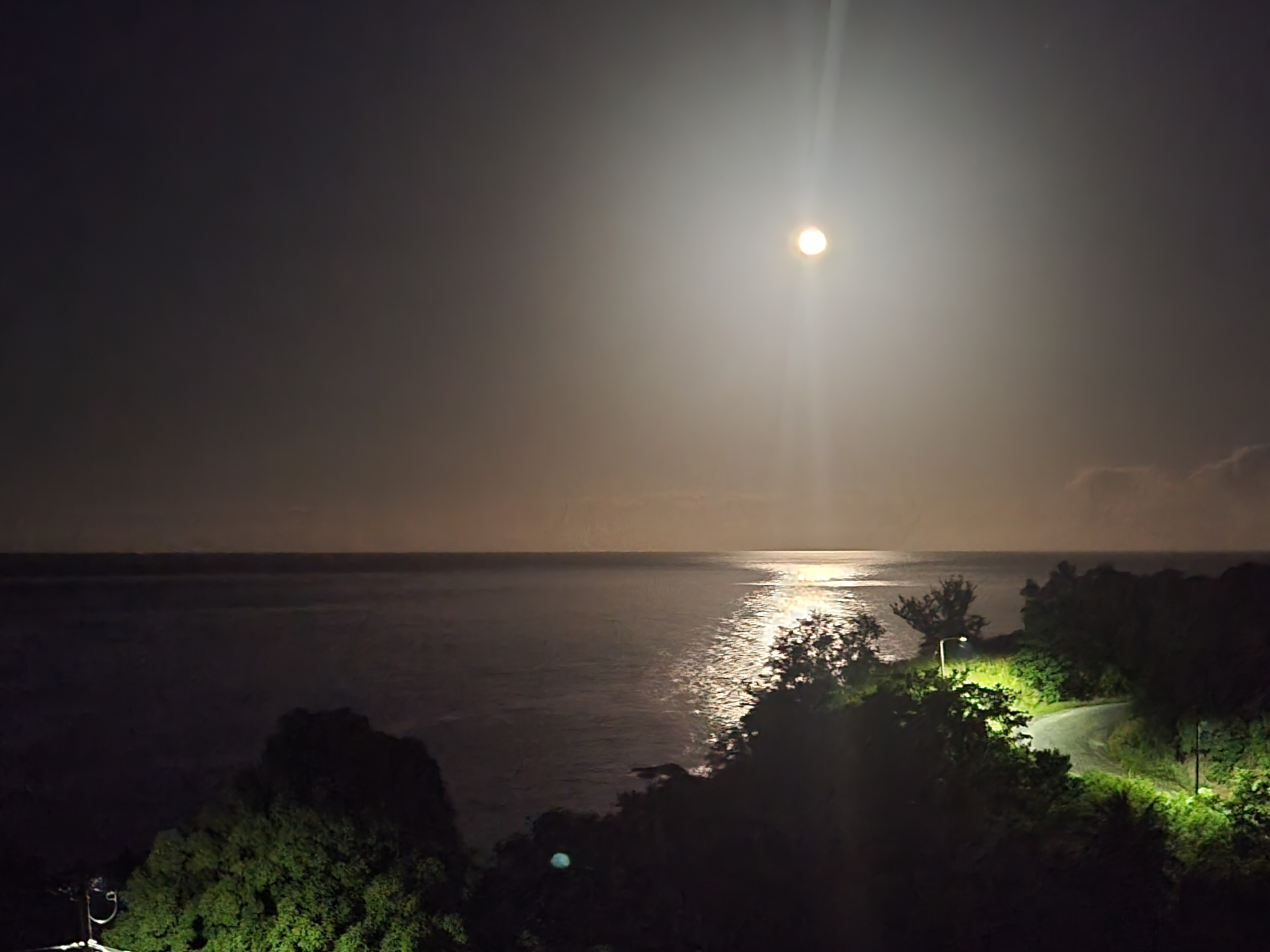 Moon reflection on the sea viewed from Southern Sunset Villa at night
